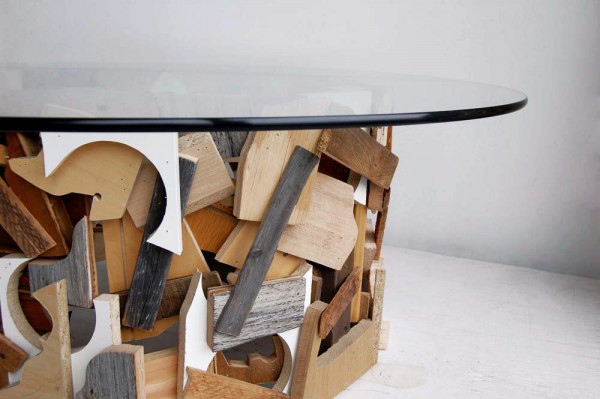 Cut-Outs Table by Grégore Abrial.  Salvaged particle boards, wood, and reclaimed glass top.
